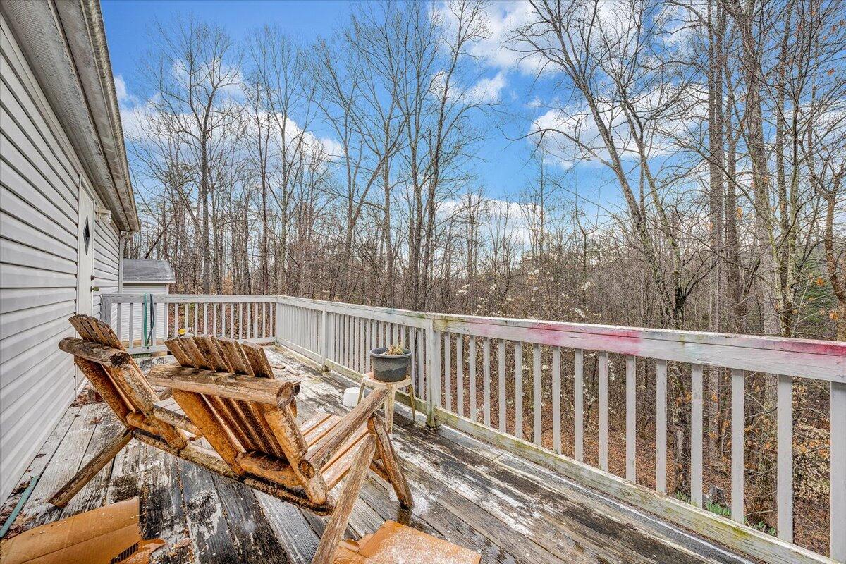 2492 Foster Road Thaxton, VA 24174 - Photo 25 of 34 a view of balcony with wooden floor and outdoor seating