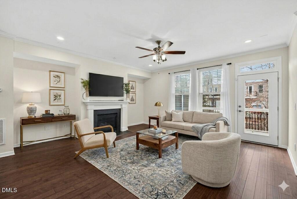 4033 Robious Court Cary, NC 27519 - Photo 11 of 58 a living room with furniture a fireplace and a flat screen tv