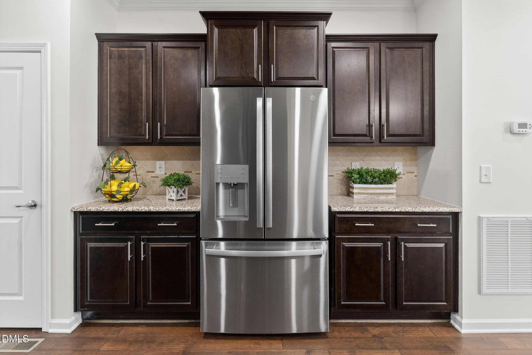 4033 Robious Court Cary, NC 27519 - Photo 17 of 58 a kitchen with a refrigerator and a stove top oven