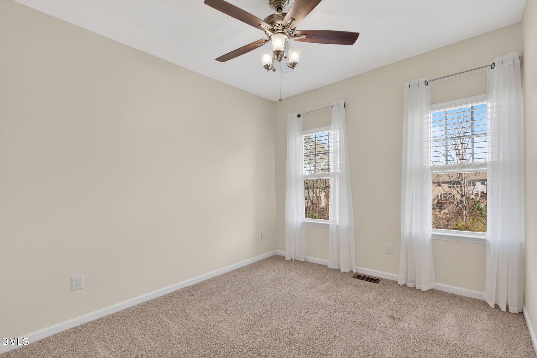 4033 Robious Court Cary, NC 27519 - Photo 29 of 58 an empty room with windows and fan