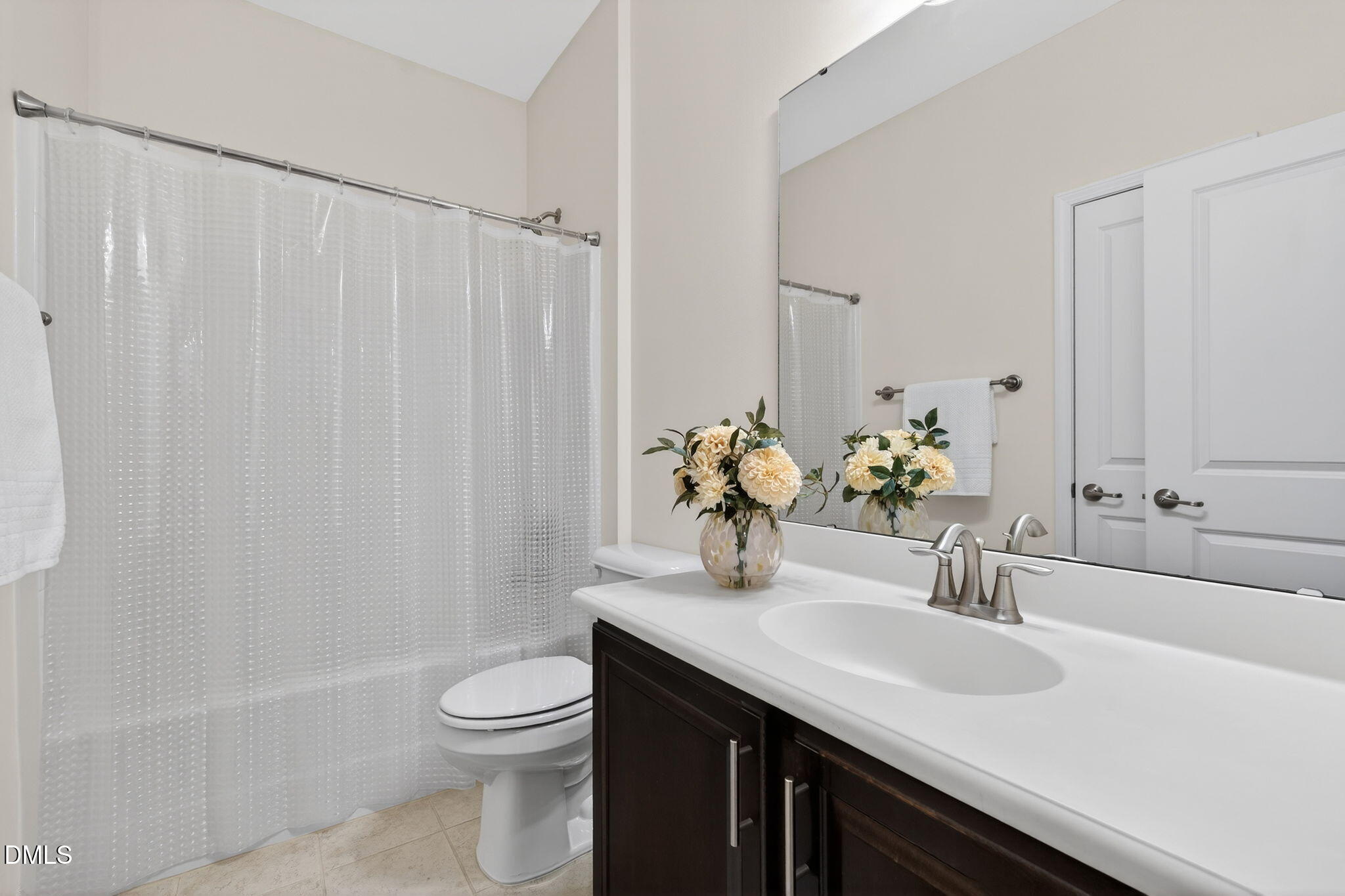 4033 Robious Court Cary, NC 27519 - Photo 33 of 58 a bathroom with a granite countertop sink toilet and a mirror