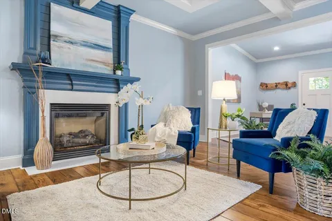a living room with furniture a fireplace and a fireplace