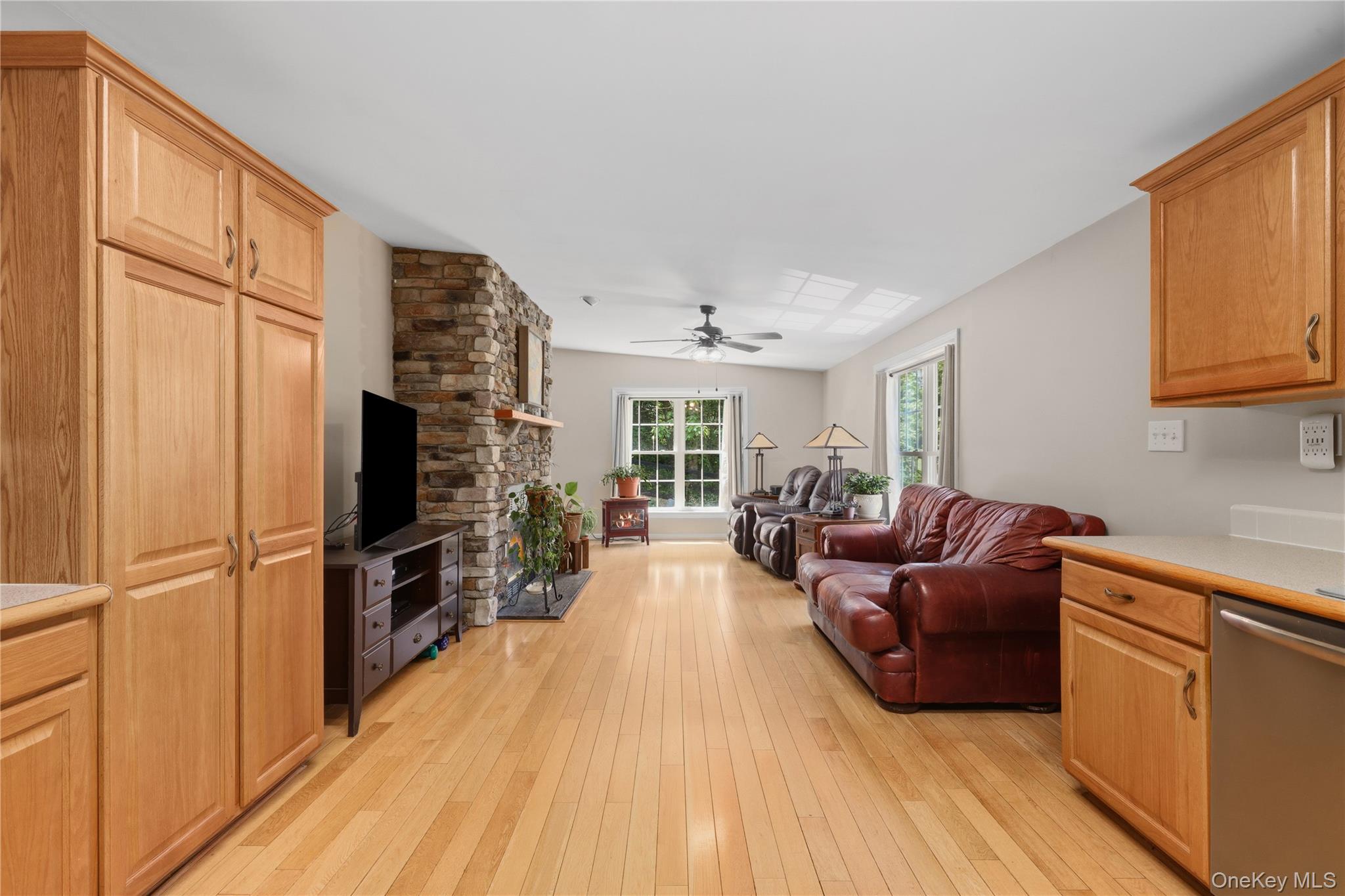 590 Farm To Market Road Brewster, NY 10509 - Photo 20 of 32 a living room with furniture a flat screen tv and a refrigerator