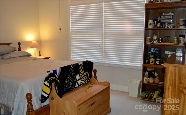 a bedroom with a bed and a closet