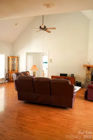 a view of a floor to ceiling window and a ceiling fan