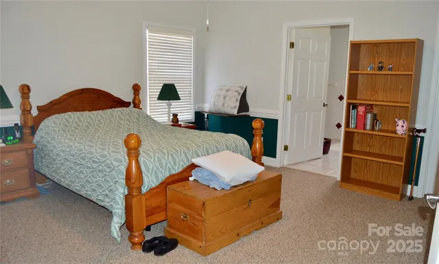 a living room with furniture pool and wooden floor