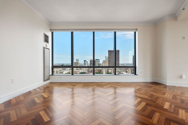 a view of an empty room and a window
