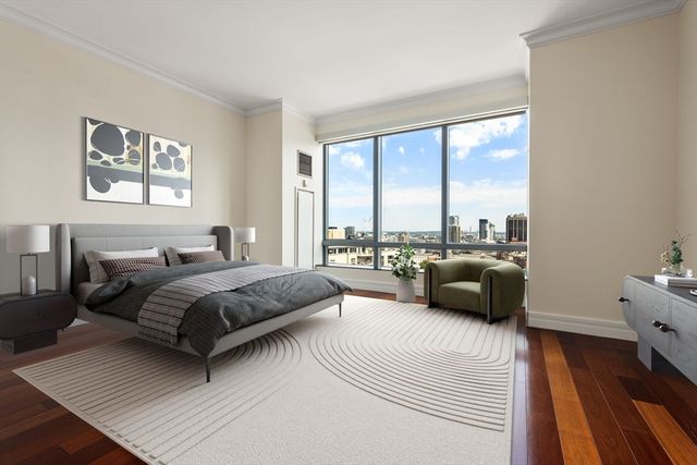 a living room with furniture large window and a table