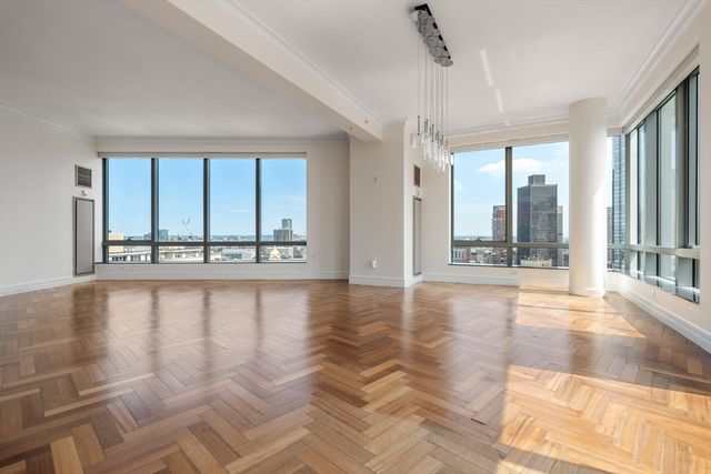 a view of an entryway with a floor to ceiling window