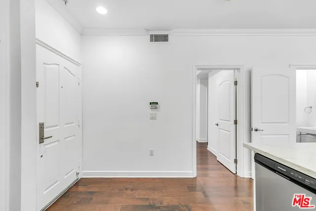 a kitchen with a sink stove top oven and cabinets