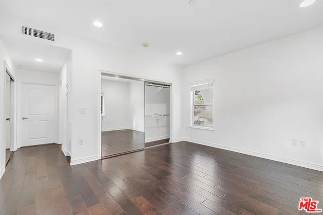 a view of a big room with an entryway