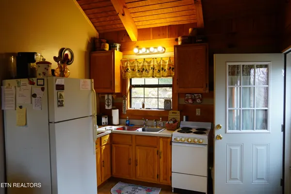 a bedroom with a bed and cabinets