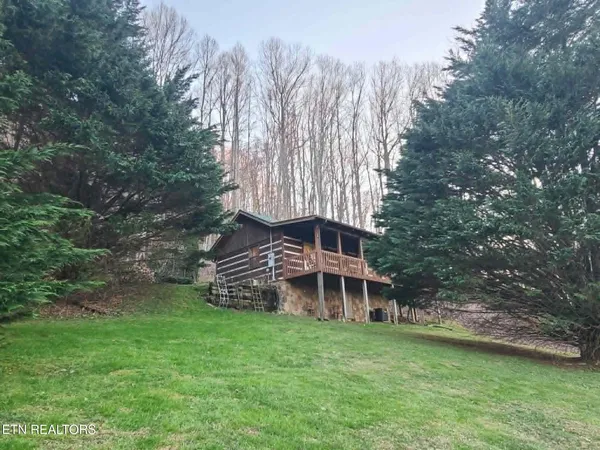 a view of balcony with floor to ceiling windows with wooden floor