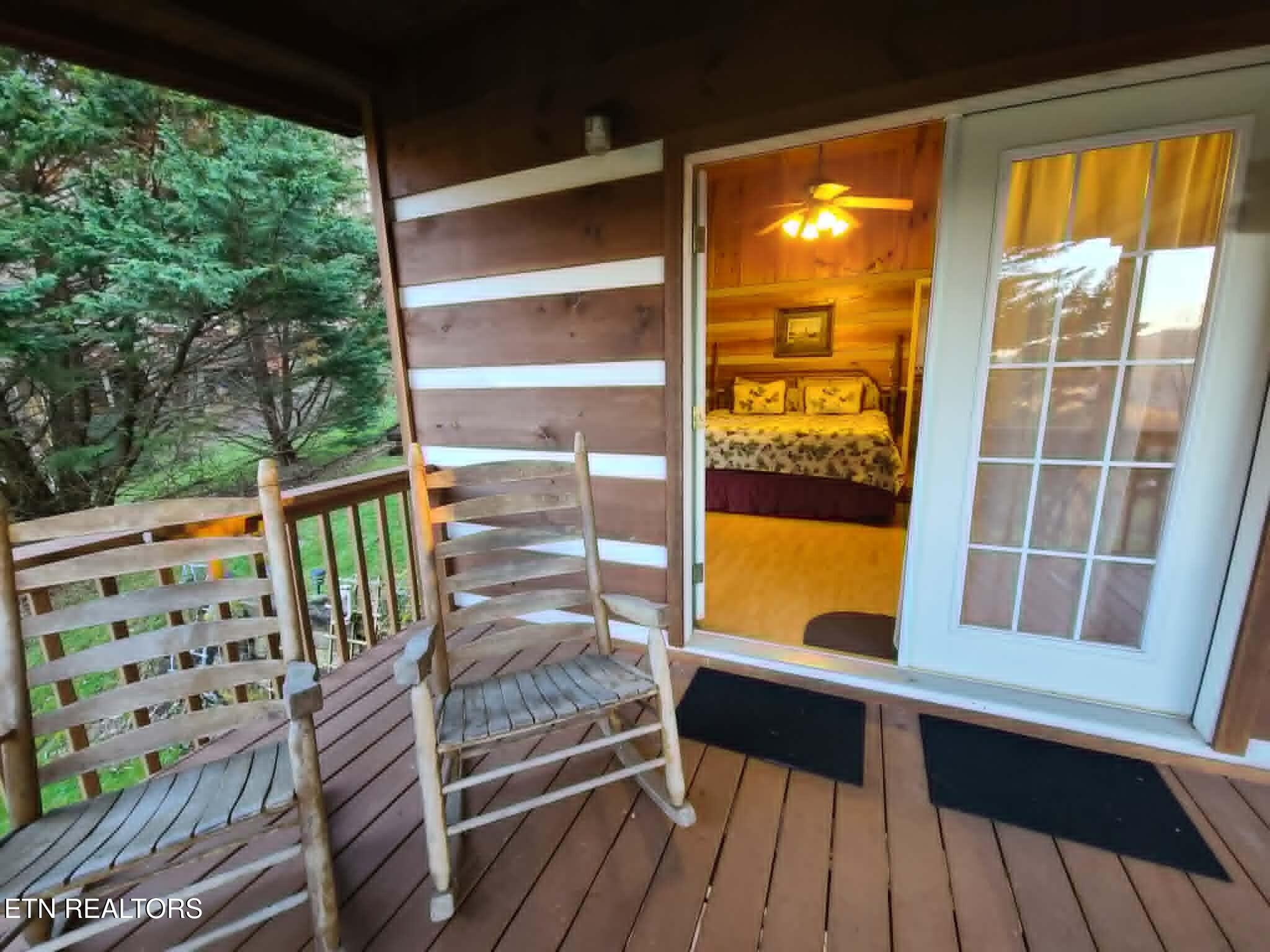 994 Emilyville Way Cosby, TN 37722 - Photo 6 of 24 a view of balcony with floor to ceiling windows with wooden floor