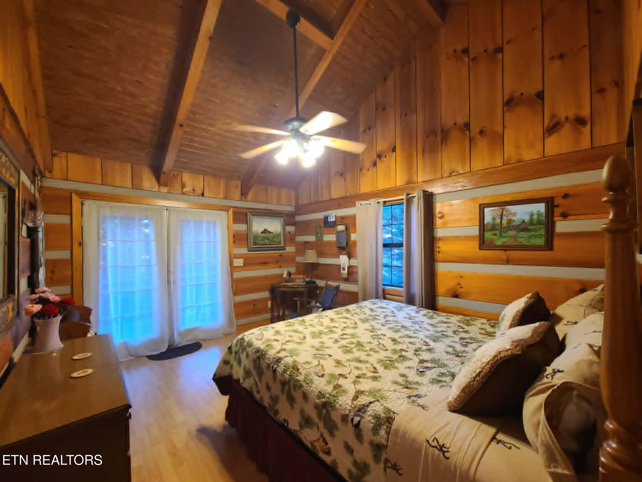 994 Emilyville Way Cosby, TN 37722 - Photo 9 of 24 a bed sitting in a bedroom next to a window