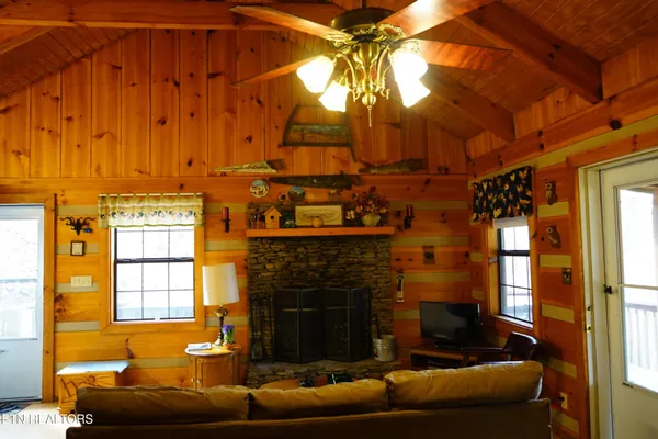 a living room with furniture and a window