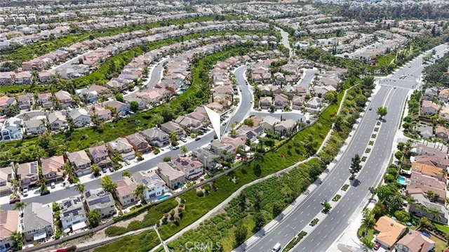 an aerial view of residential houses with city view
