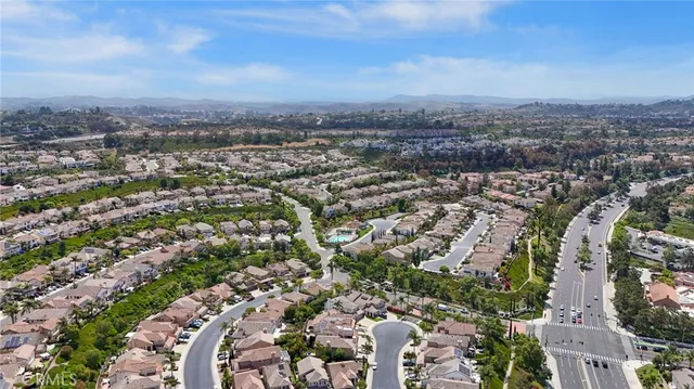 an aerial view of residential building and parking space