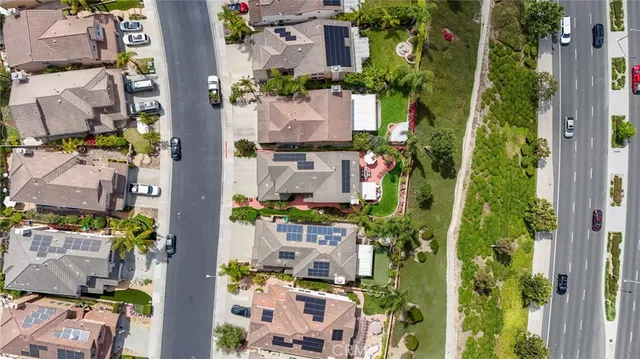 an aerial view of residential houses with outdoor space