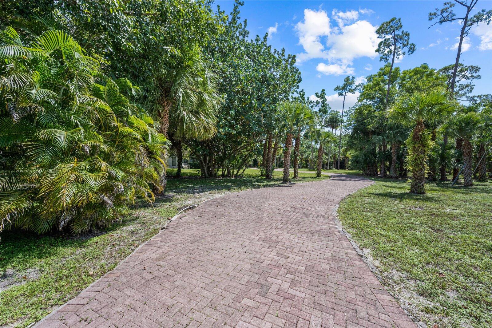 790 East Rambling Drive Wellington, FL 33414 - Photo 14 of 44 Long gated driveway