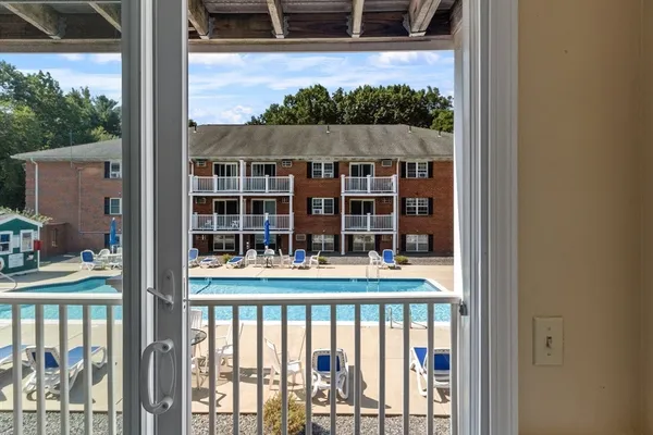 a view of a swimming pool with a lounge chairs