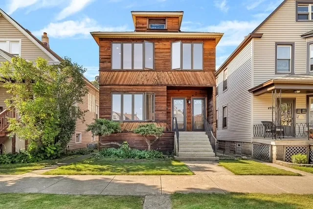 front view of a house with a yard