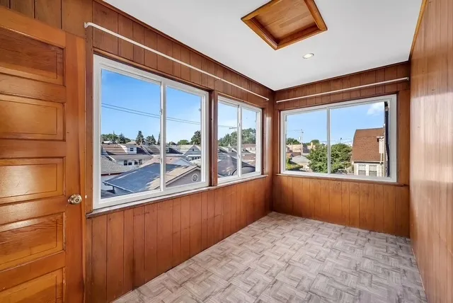 a view of a room that has a large window