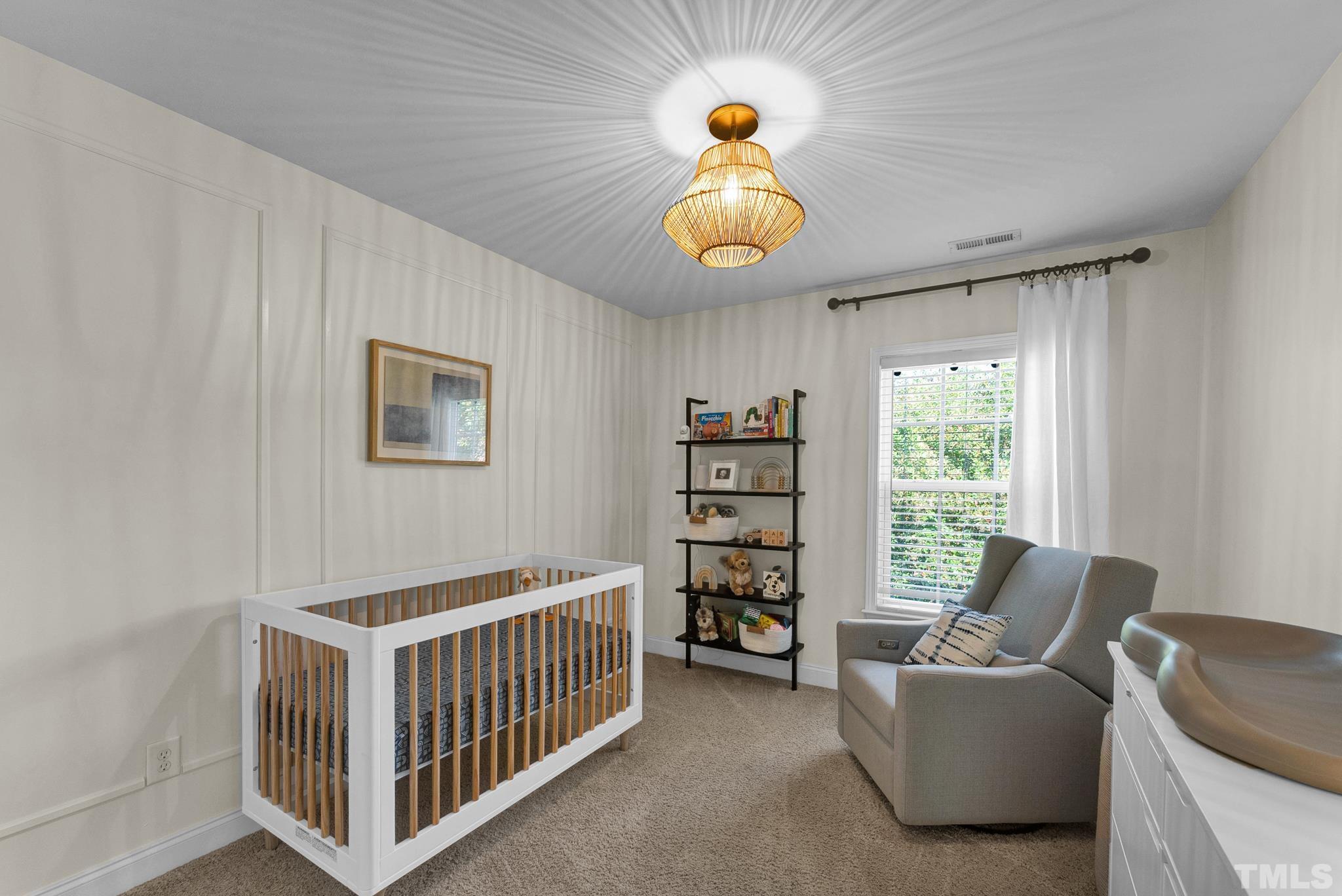 161 Ryder Cup Circle Raleigh, NC 27603 - Photo 18 of 31 a bedroom with furniture and a window