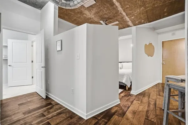 a view of a livingroom with wooden floor and entryway