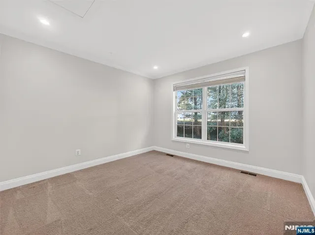 a view of a deck with a bench and wooden floor