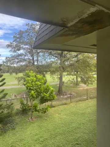 a view of backyard of a house with oven