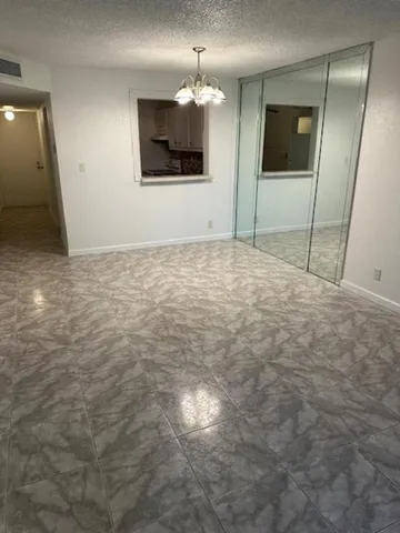 a view of a livingroom with a flat screen tv