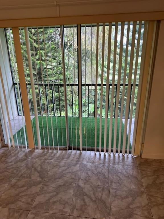 7831 North Colony Circle, Unit 203 Tamarac, FL 33321 - Photo 5 of 13 a view of a porch