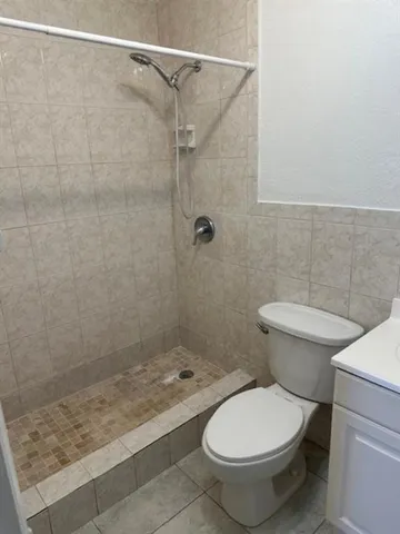 a bathroom with a toilet and a sink
