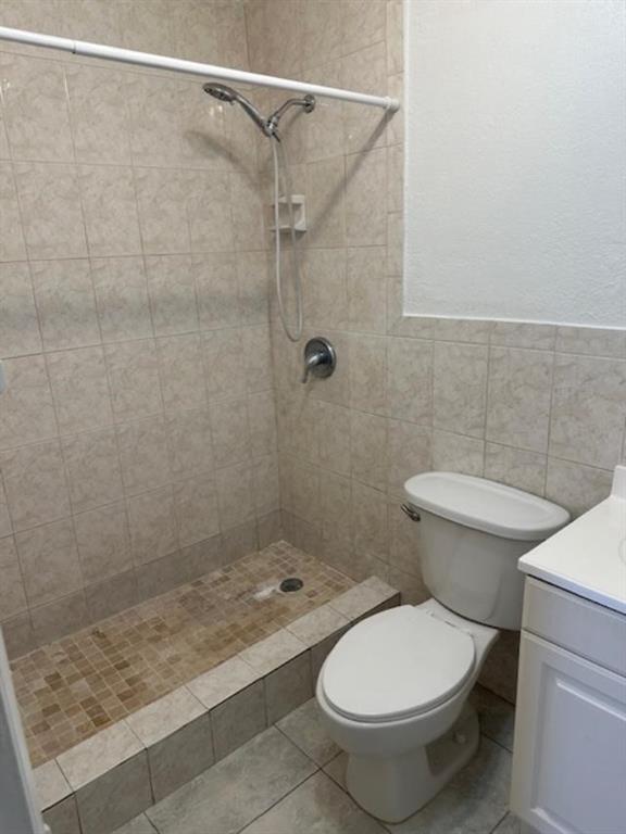 7831 North Colony Circle, Unit 203 Tamarac, FL 33321 - Photo 8 of 13 a bathroom with a toilet and a shower