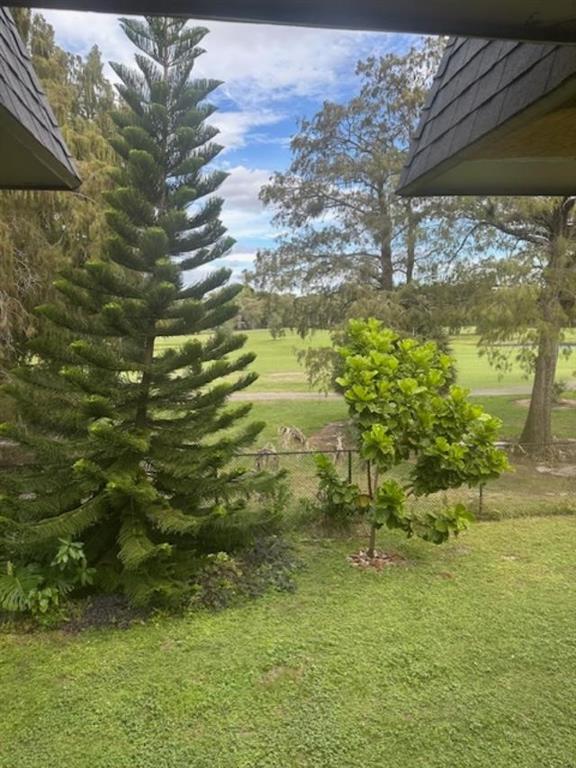 7831 North Colony Circle, Unit 203 Tamarac, FL 33321 - Photo 10 of 13 a view of a yard with an outdoor space