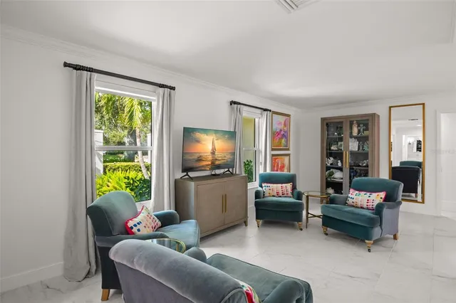 a living room with furniture a rug and a window