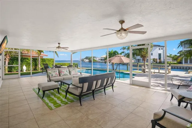 a view of a patio with a dining table and chairs
