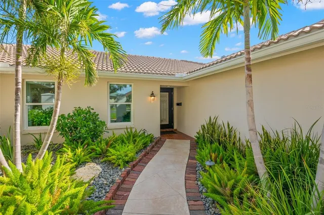 a kitchen with a sink and refrigerator