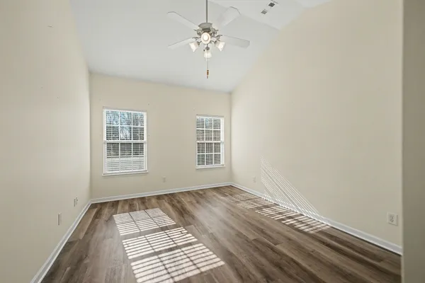 a view of an empty room with a window
