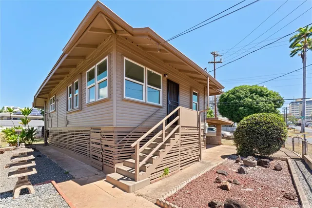 a front view of a house with garden