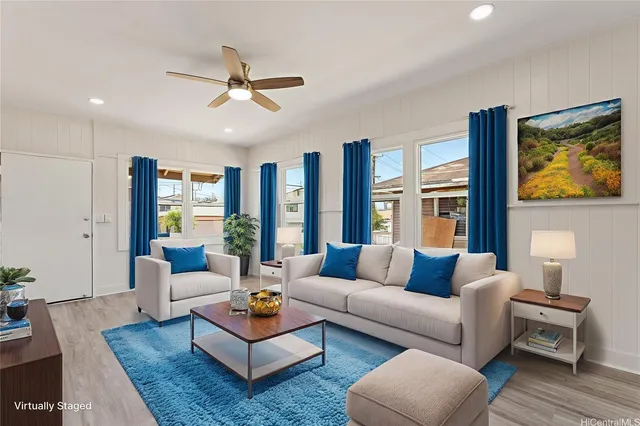 a living room with furniture and a large window