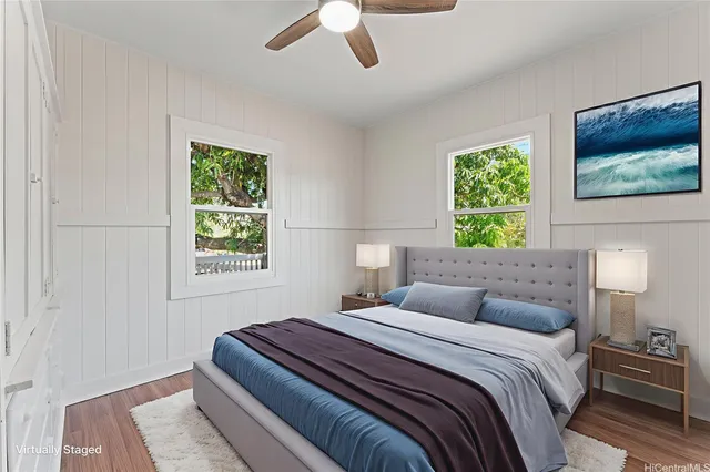 a bedroom with a bed lamp and a window
