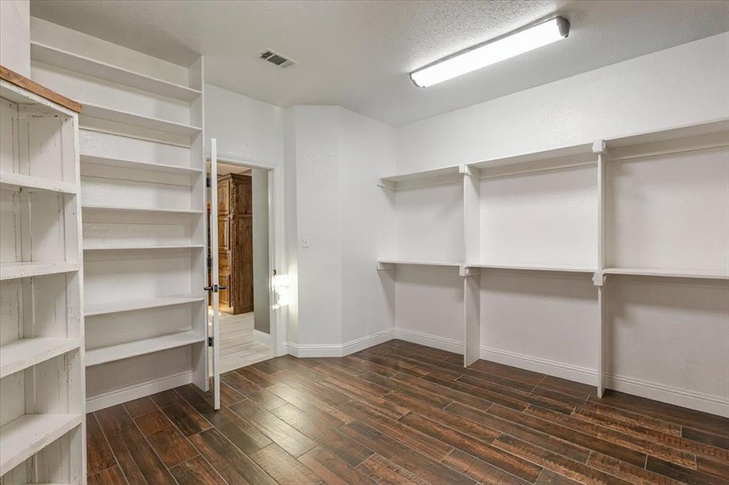 10106 Prather Road Springtown, TX 76082 - Photo 16 of 40 a view of an empty room with empty racks