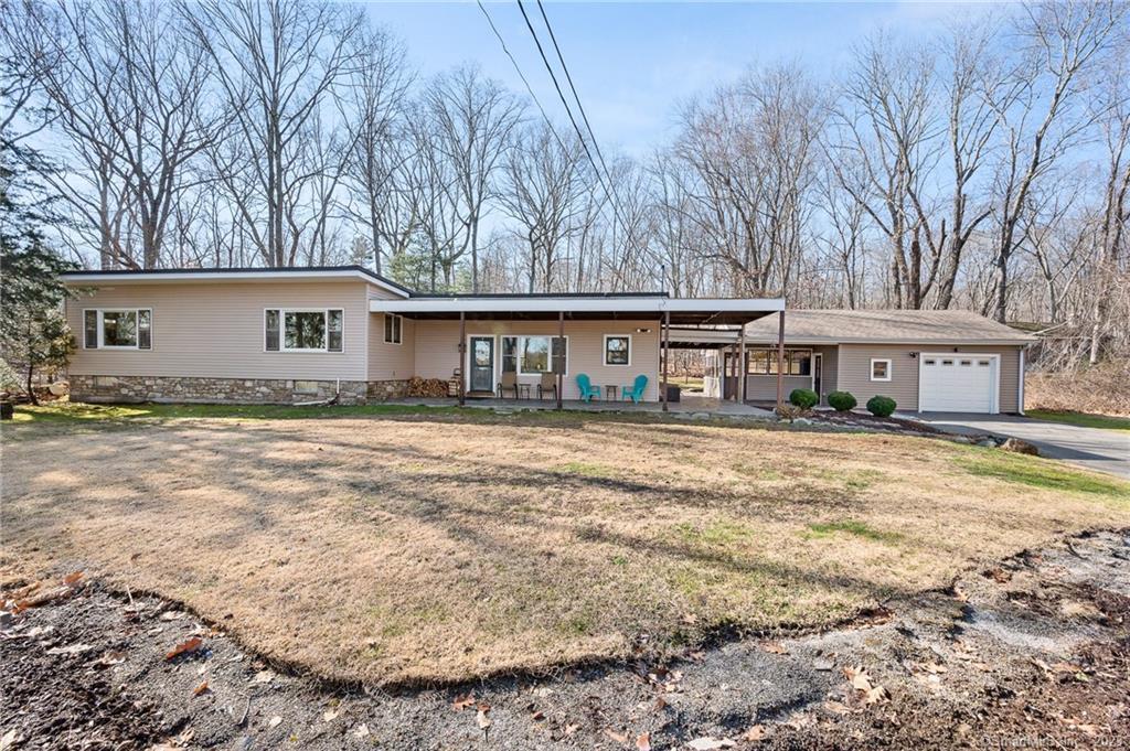 24 Hanover Versailles Road Sprague, CT 06330 - Photo 1 of 1 a house that has a tree in front of it