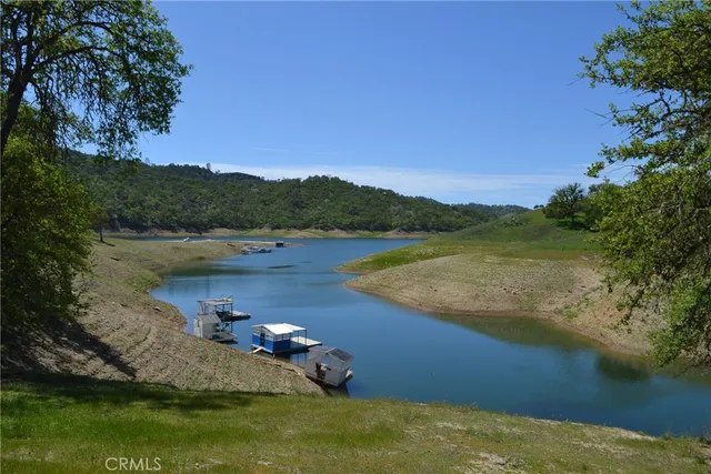 a view of a lake with houses in the back