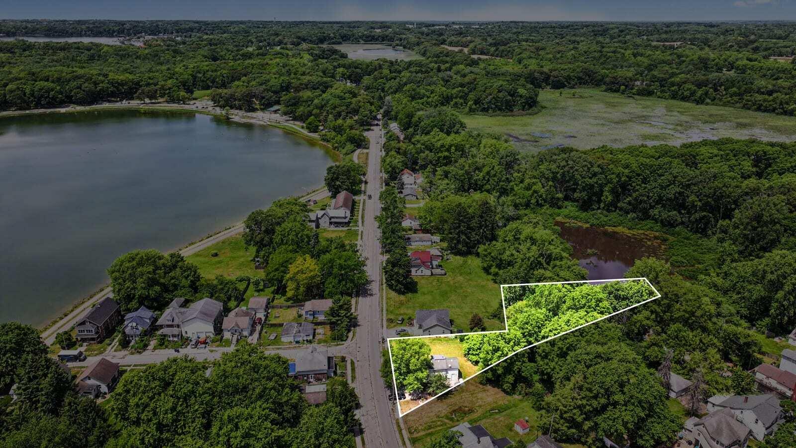 115 McClung Road La Porte, IN 46350 - Photo 2 of 31 an aerial view of a house with a yard and lake view