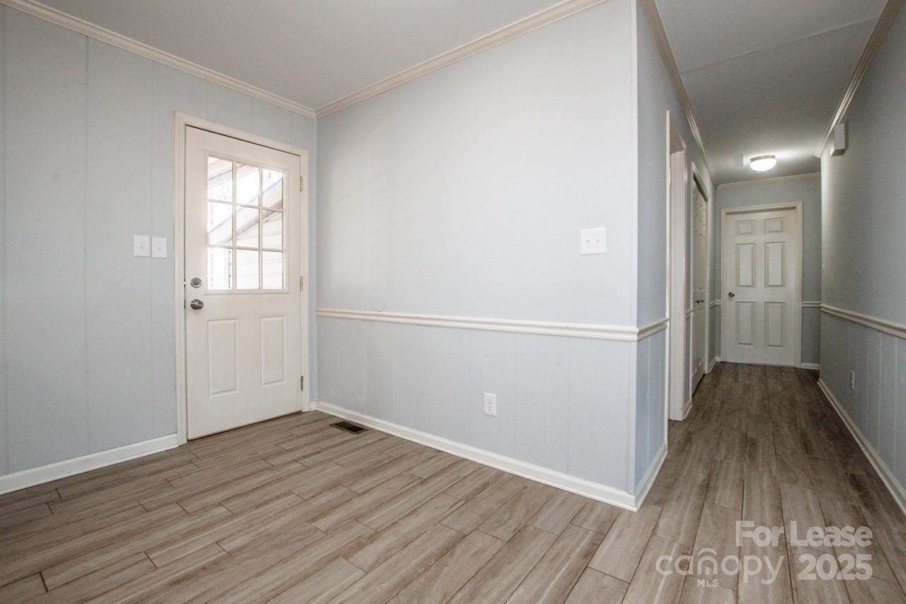 1159 Camp Creek Road Iron Station, NC 28080 - Photo 21 of 48 wooden floor in an empty room with wooden floor