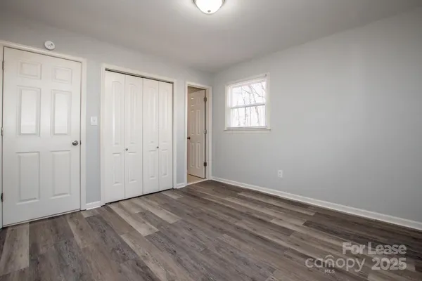 a kitchen with a refrigerator sink and cabinets