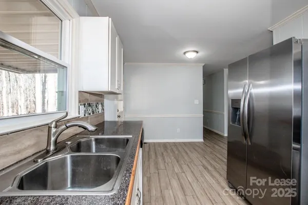 a kitchen with a stove and a sink